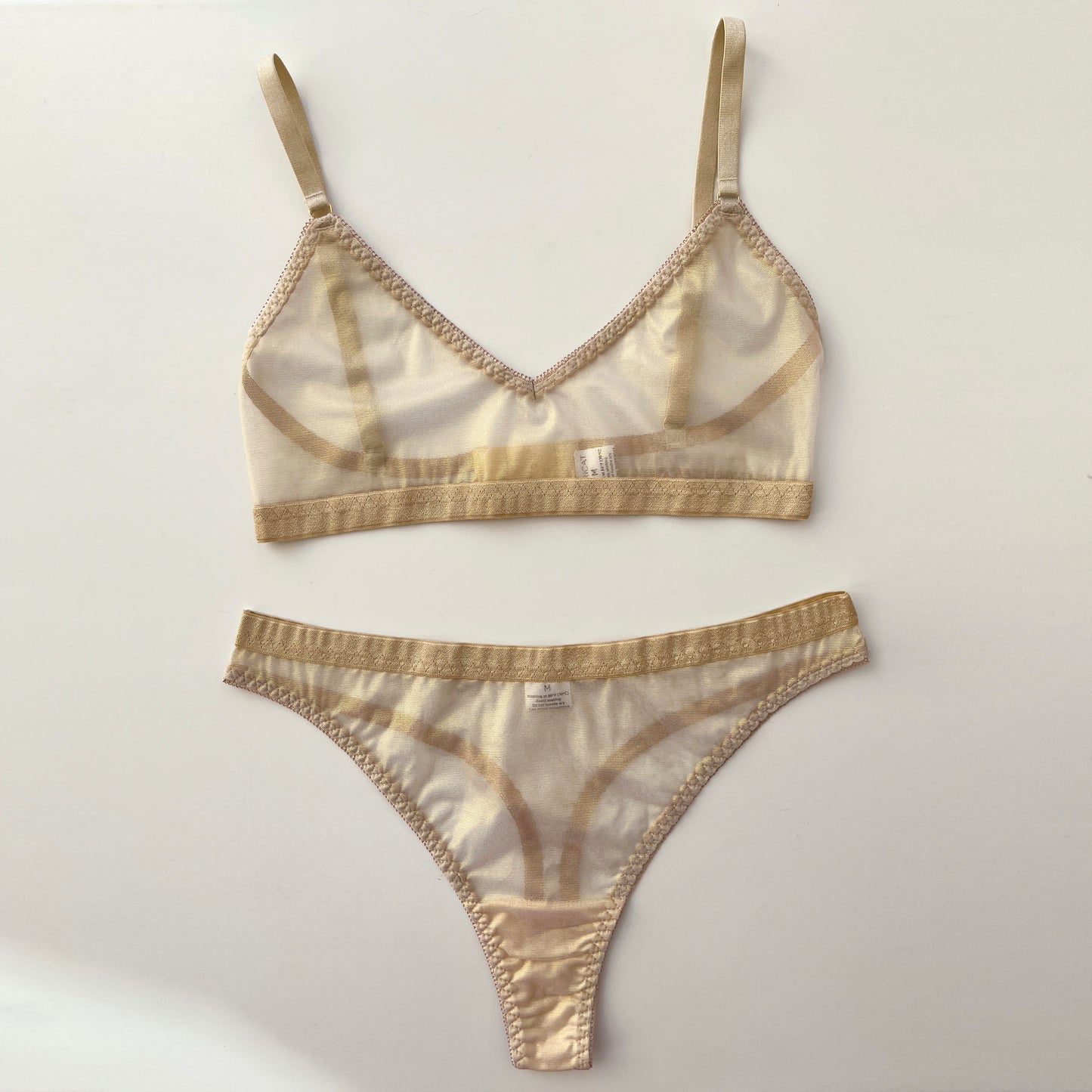 Shimmering mesh thongs